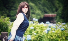 High school girl in hydrangea garden